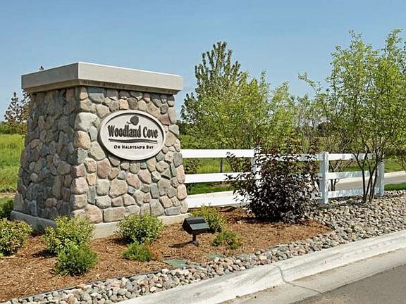 Woodland Cove community featuring new Mackenthun's grocery store, liquor store and Caribou coffee