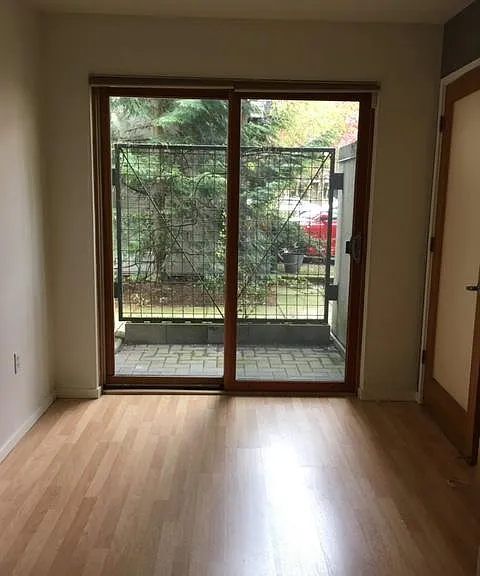 Den with sliding door patio