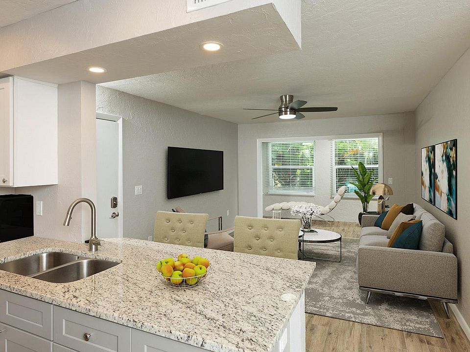 Kitchen view into living room and Florida room