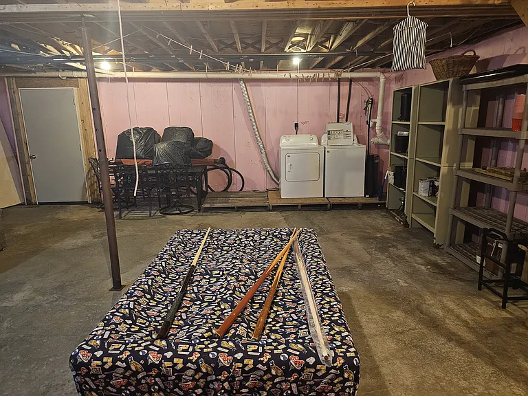 Basement with W/D, outdoor table, and bumper Pool table.