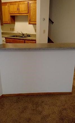 Add stools and eat at the snack bar. Open from kitchen to eating area and living room so you don't miss the action while cooking a meal.