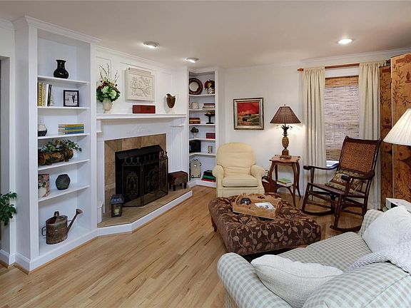 Hearth room with ventless gas fireplace is open to kitchen and breakfast room.