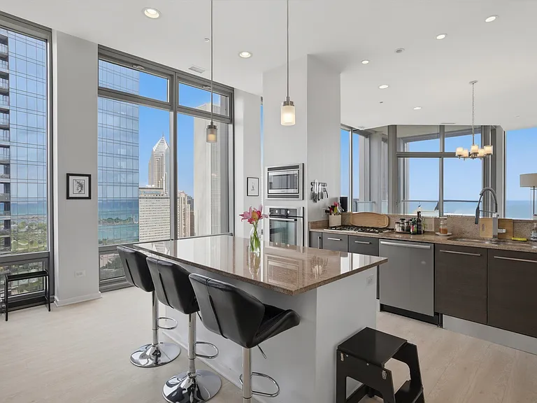 Stainless steel appliances, plenty of cupboards and an open floor plan with amazing views on two sides!
