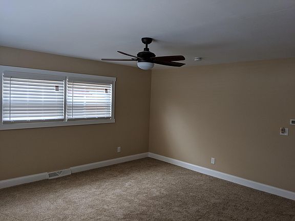 Living Room. Brand new carpeting and energy efficient windows. All new electrical, plumbing, drywall, insulation, and paint. Air ducks professionally cleaned in 2017. Pest control service provided.
