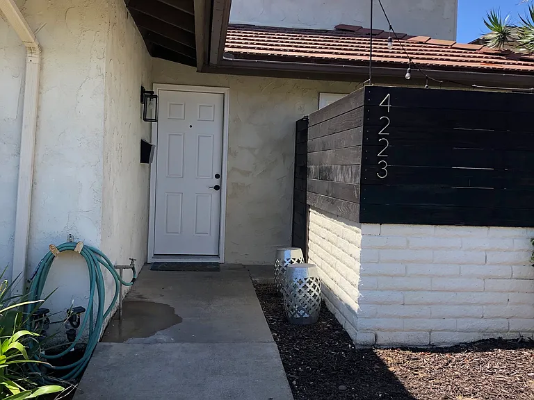 Front door & outside patio to the right