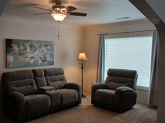 Living Room taken from dining area. Furnishings and curtains not included.