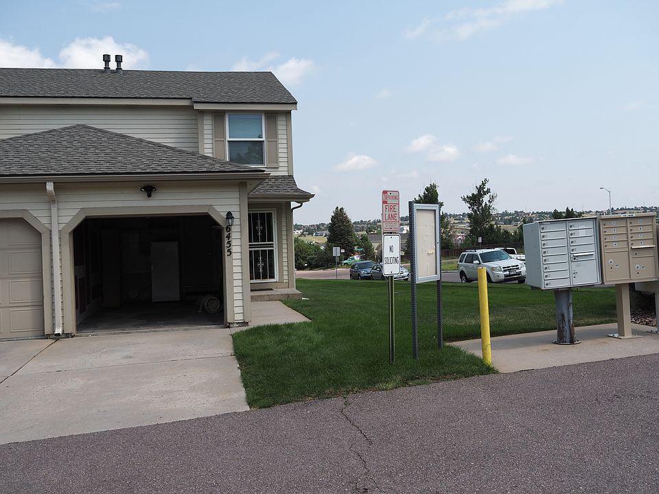 Front of townhome. Nicely maintained grass. Mailboxes are close. Quiet neighborhood and great neighbors. Ring motion detection floodlight. Automatic safety porch lights.