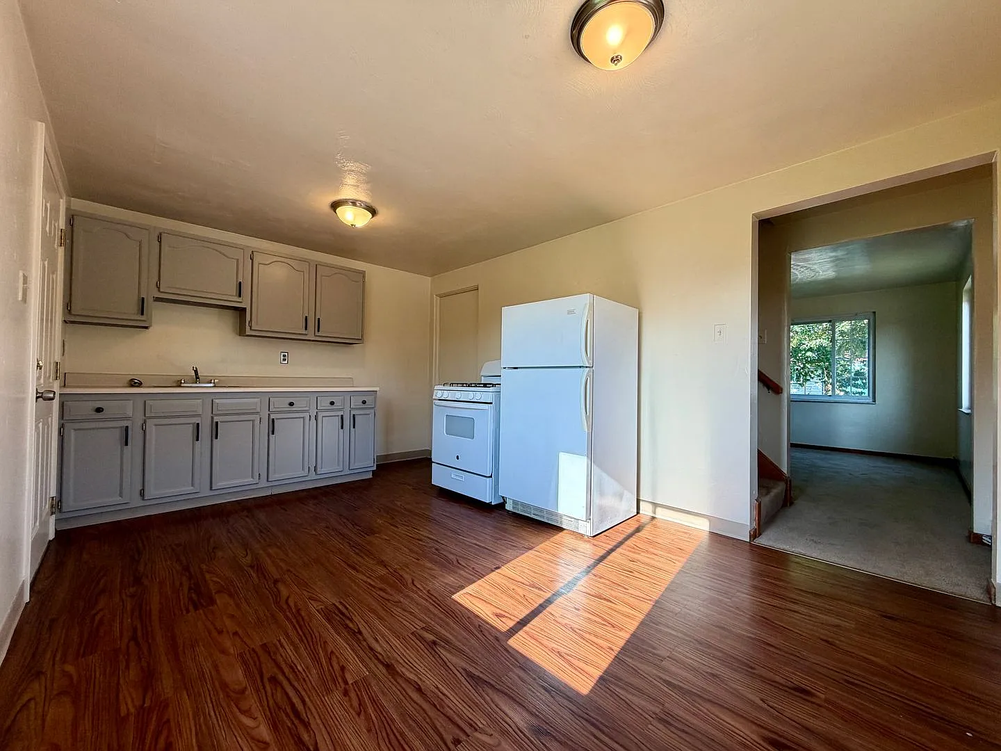 Charming Two Bedroom Townhome with a Private Basement & a Shared Backyard Space! Call Today! — Photo 2