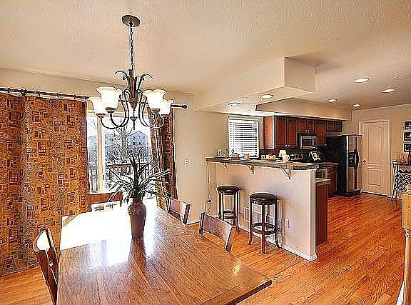 Large kitchen/dining area with breakfast bar.