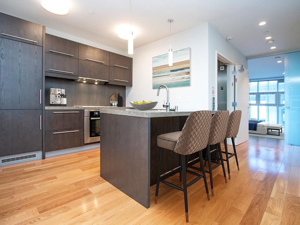 open kitchen with cabinet-front, high-end appliances