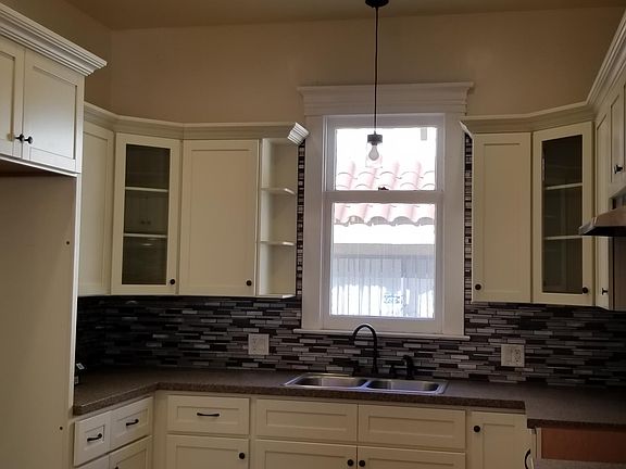 Custom Built Kitchen with New Cabinets, Countertop and Back splash.