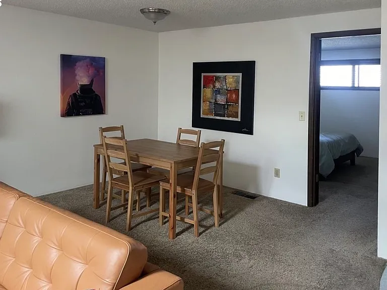 Full kitchen and dining area.