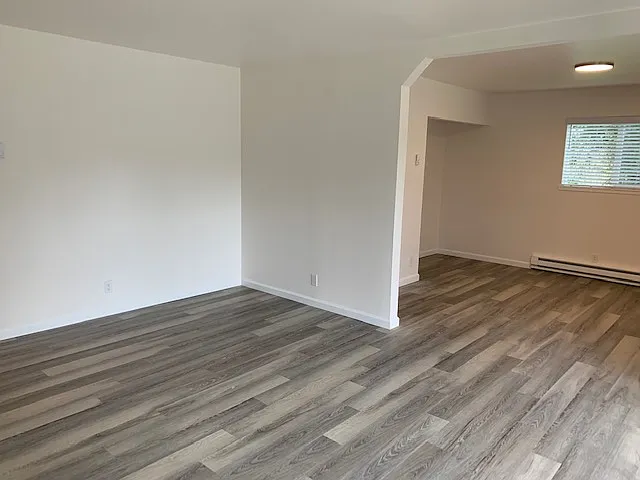 Living room and den with brand new wood plank floors