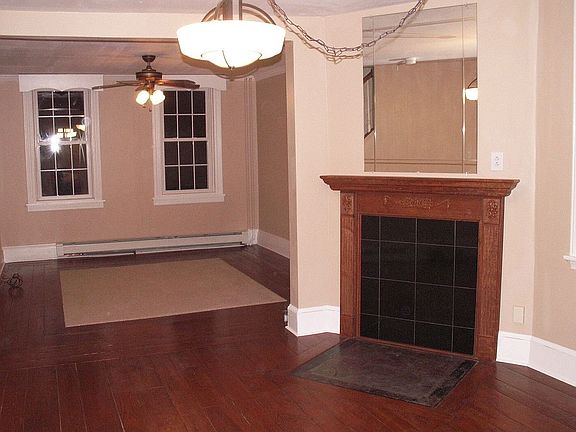 Inlaid carpet and faux fireplace