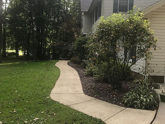 Prof landscape abets house