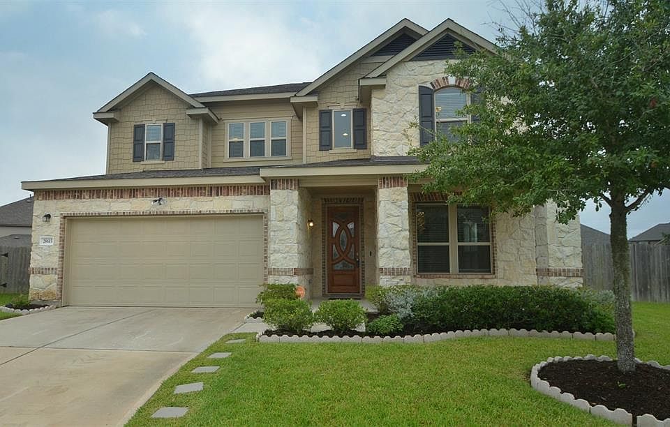 Beautiful stone and brick home on cul de sac oversized corner lot featured covered front porch.
