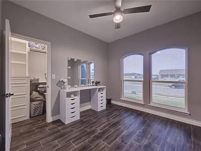 Guest Bedroom 2 featuring a spacious closet with ample natural light.