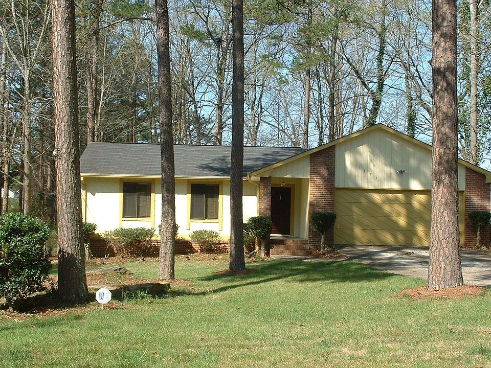 Lovely ranch home located in a cul-de-sac with on a privately wooded homesite 