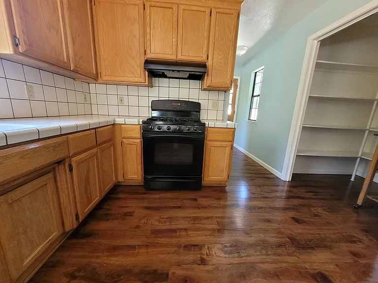 The kitchen has NEW White Granite, and cabinets have been painted White.