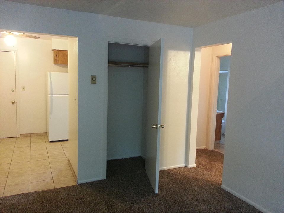 Living Room looking into dining area and hallway that leads to bathroom and bedroom