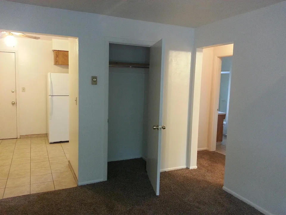 Living Room looking into dining area and hallway that leads to bathroom and bedroom