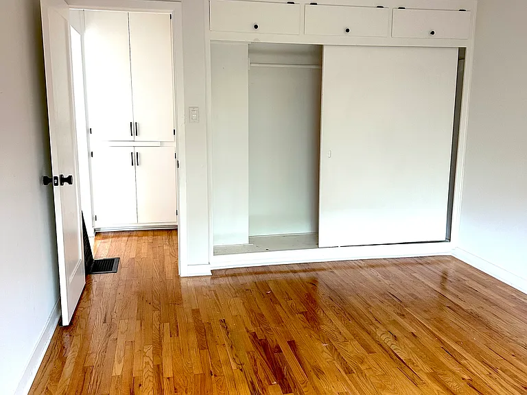 Bedroom with wall-to-wall closet.