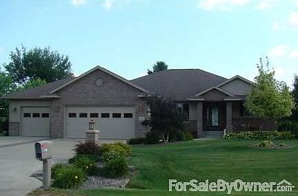 Front view from Heide Lane : Stainless Steel siding, soffit and fascia with brick. ABC seamless gutt