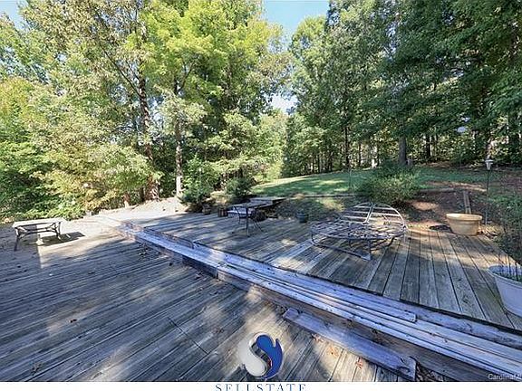 Gorgeous private backyard with over sized deck for great entertaining or just enjoying the gorgeous Carolina sunshine.
