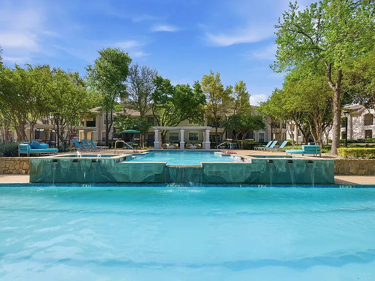 Pool with waterfall over looking lap pool