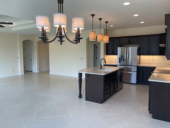 24" square tiles throughout living, dining, hallways and kitchen