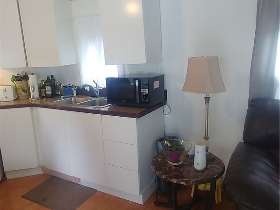 Kitchen opening to living room.