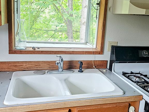 The kitchen has a window box which overlooks the creek.