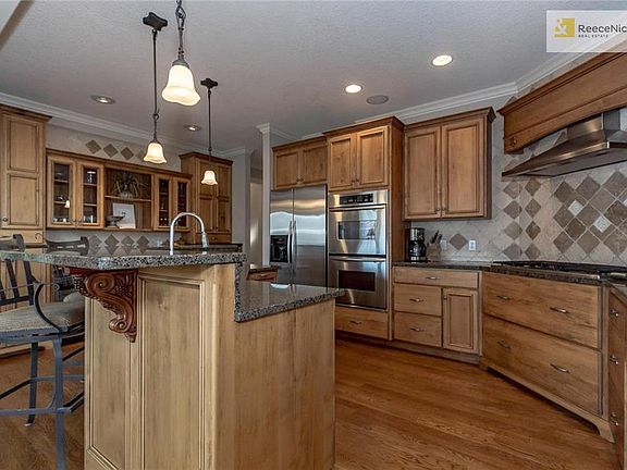 You'll fall for this gorgeous, super functional kitchen with double ovens, gas stovetop, two-tier center island for both dining and work space, tremendous butler's pantry, and immaculate custom cabinetry