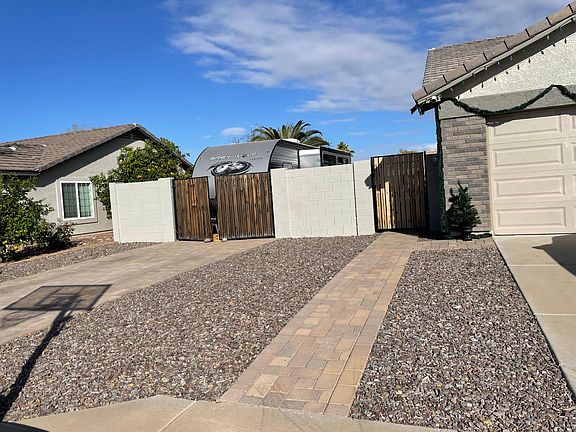 View of side driveway and RV parking on west side of house