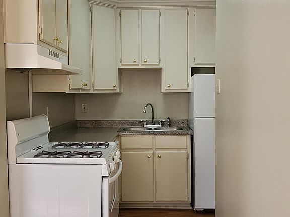 Kitchen includes gas stove, refrigerator and dishwasher