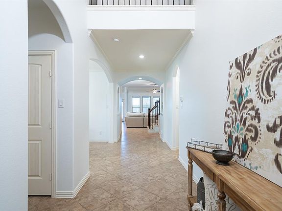 Open the door into this bright and open entryway that leads you to the main living spaces in this home!