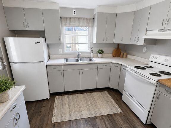 Fresh and Bright Kitchen with Stove and Fridge