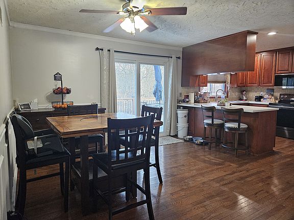 Dining room/kitchen with sliding glass door to back deck.