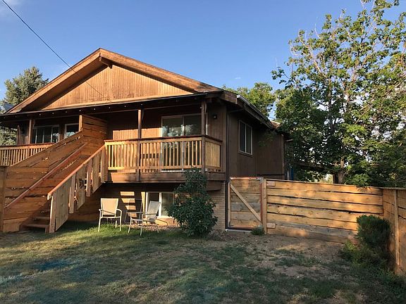 Back porch and fenced back yard