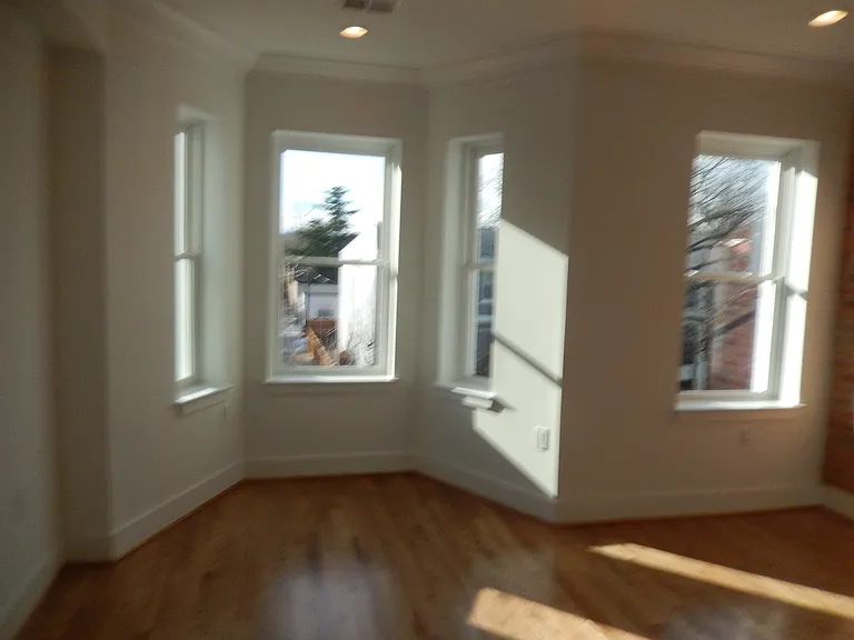 Spacious master bedroom, flooded with natural light.