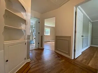 Hallways to the entrance for both rooms