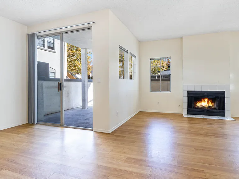 Living Room with Fireplace and Balcony