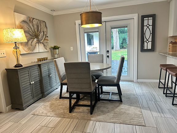 Breakfast nook is open to the kitchen and outside for entertaining