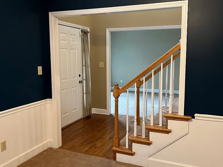 looking from formal dining to the entry & formal living area