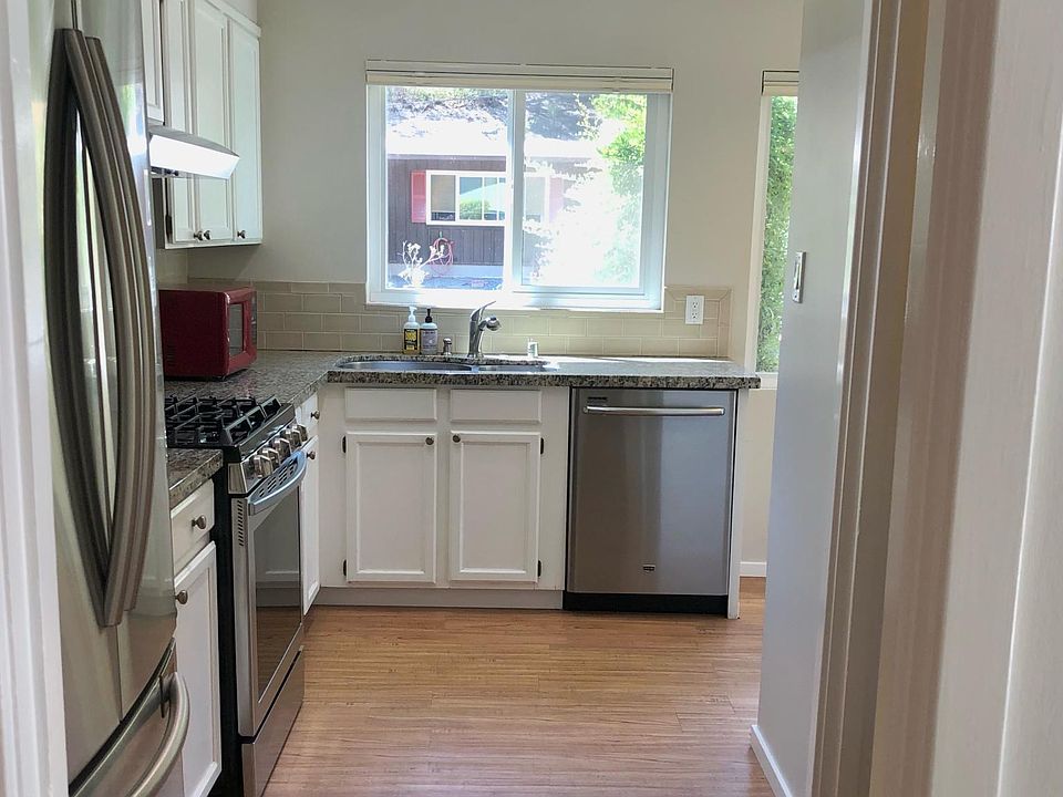 Looking in at the kitchen... three windows ahead providing an abundance of natural light.