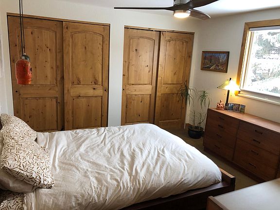 Master bedroom with queen size bed and en suite bathroom