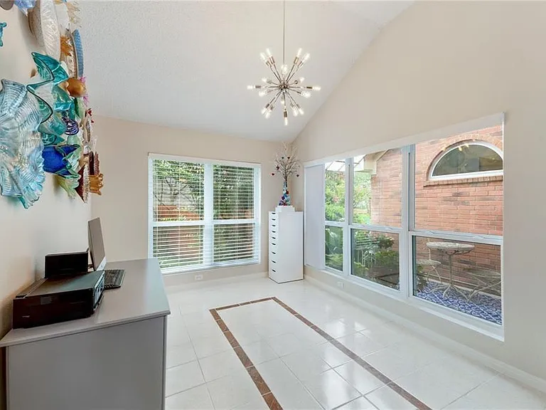 Dining area overlooking sunroom/patio.
