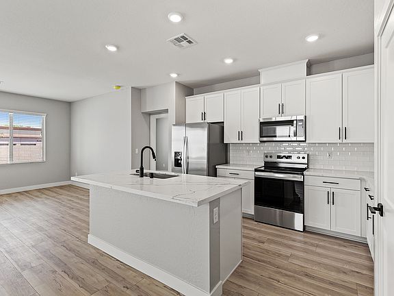 This kitchen is the perfect layout for preparing your favorite meals.