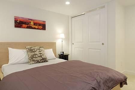Bedroom with queen-sized bed, spacious closets, and air cond