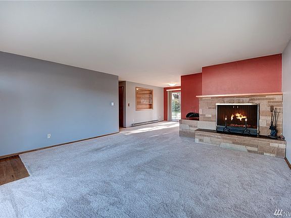 A wonderful wood burning fireplace with classic hearth and mantel will warm the room on chilly nights.